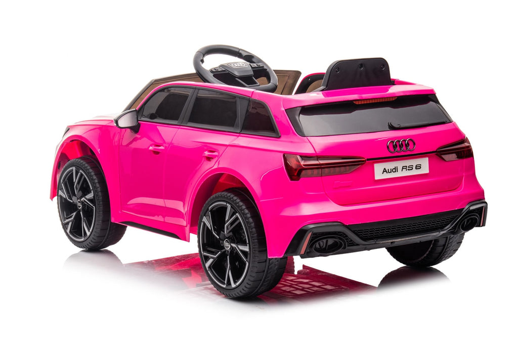 Kids riding an Audi RS6 electric ride-on sports car with MP4 TV, designed for children’s outdoor play and adventure.